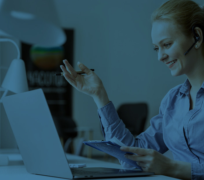 Woman in front of computer with blue overlay