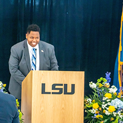 Richard speaking at LSU event