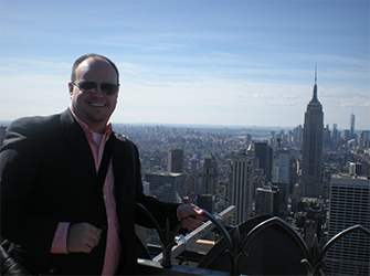 Joe with a city skyline