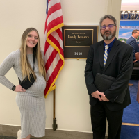 Matt and Kayli standing outside Randy Feenstra's office