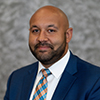 headshot of Alex DeLonis, FAAC